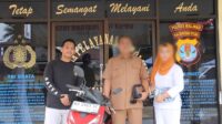 Anggota Reskrim Polsek Malinau Kota bersama korban dan sepeda motor curian yang berhasil ditemukan.